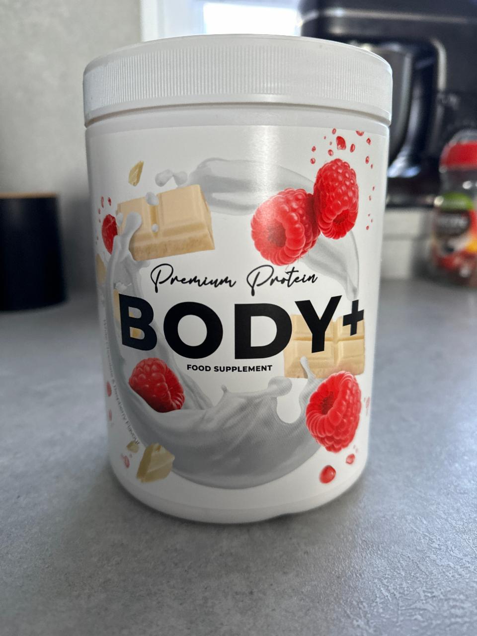 Fotografie - Premium Protein White Chocolate & Raspberry flavour BODY +